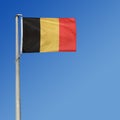 Belgian flag in the blue sky